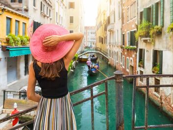 Picture of a lady looking at the Venice canal.